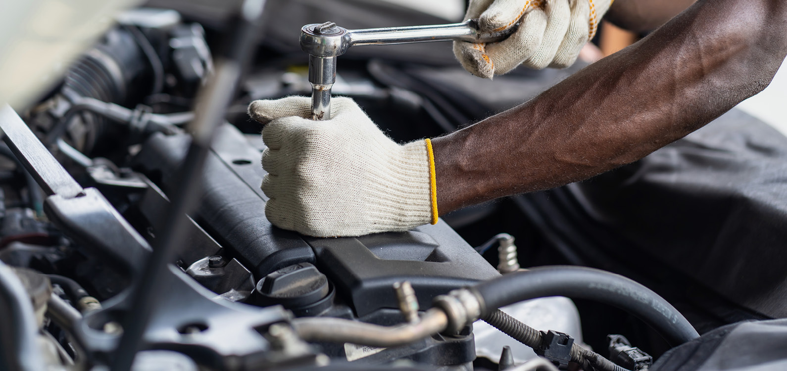 Mechanic hands working on engine